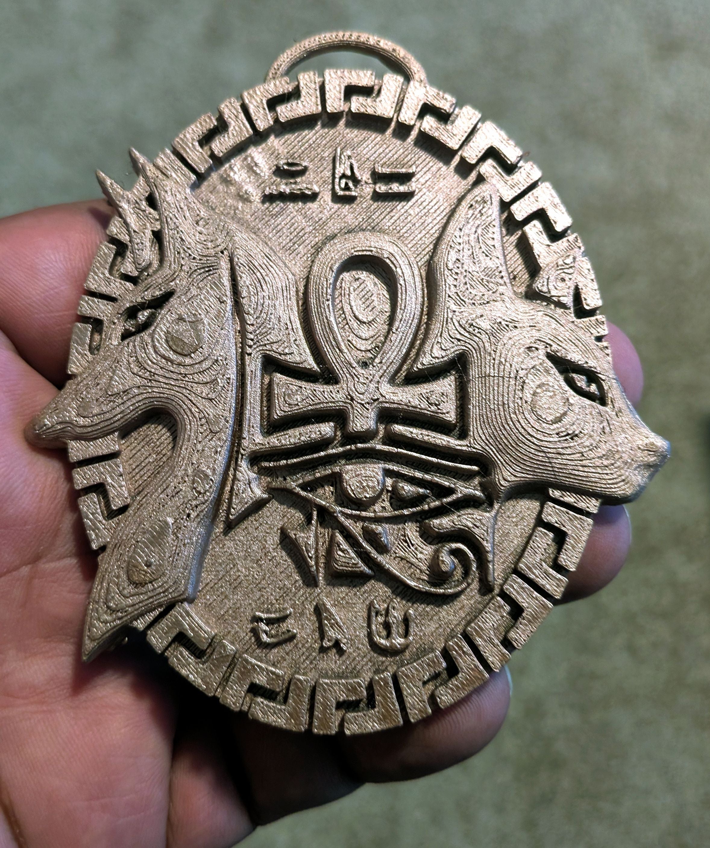 The Anubis and Bast medallion